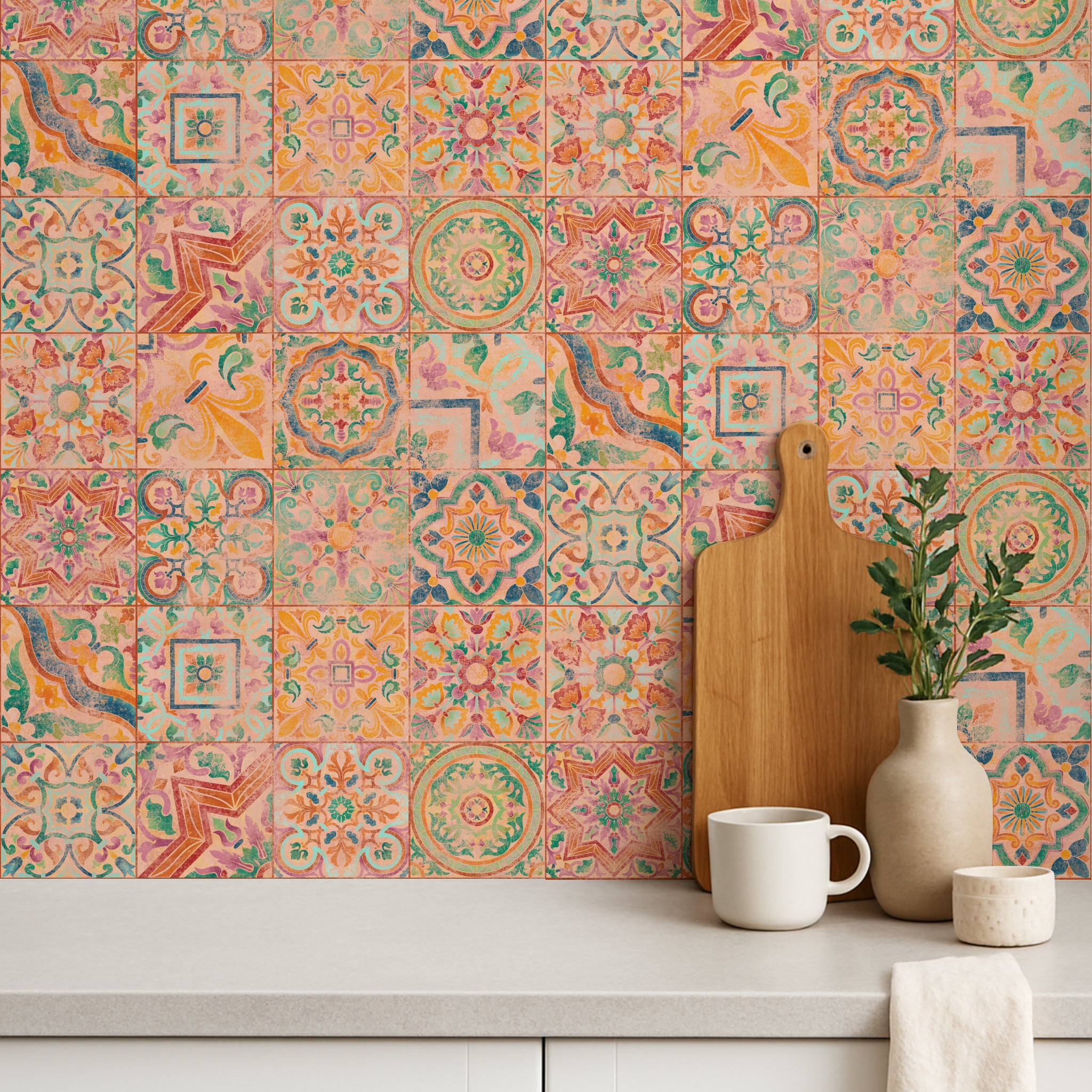 Colorful patterned tile wall with a wooden cutting board, white mug, and decorative plant.